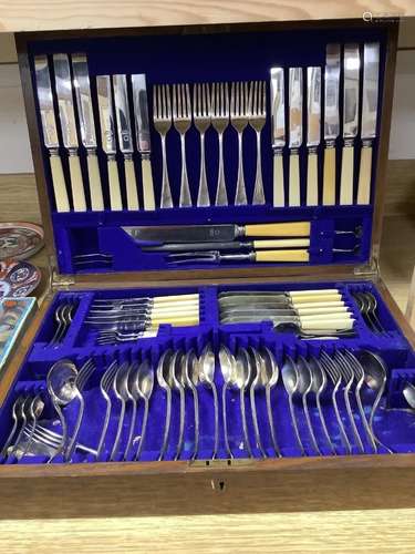 An Edwardian oak canteen of plated flatware