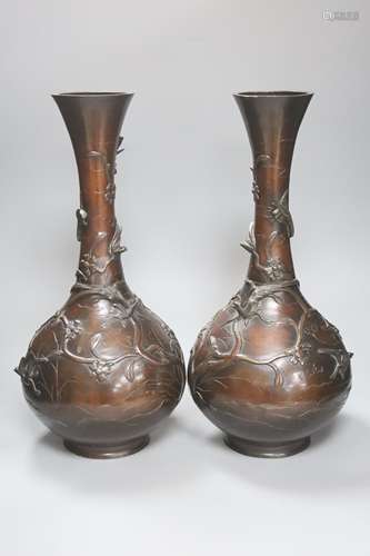 A pair of Japanese Meiji period bronze bottle vases, repaire...