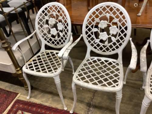 A set of four white painted alumiunum garden elbow chairs, w...
