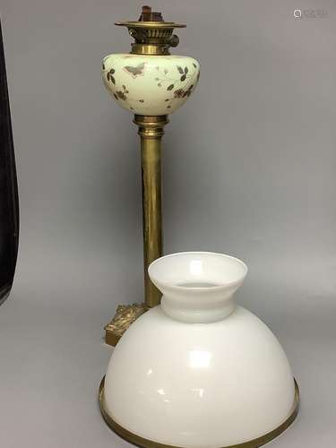 A Victorian brass and ceramic oil lamp, overall height inclu...