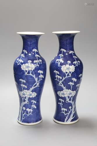 A pair of slender Chinese blue and white prunus vases, late ...