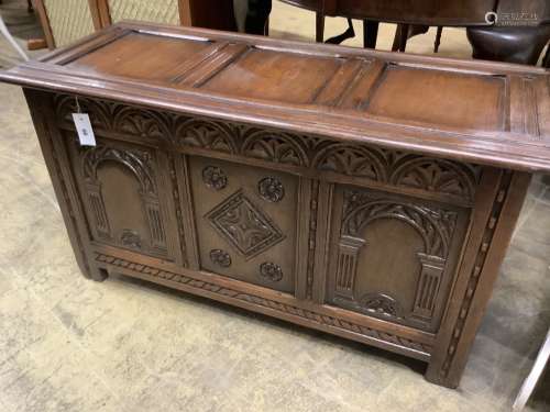 An 18th century style carved oak panelled coffer, width 105c...