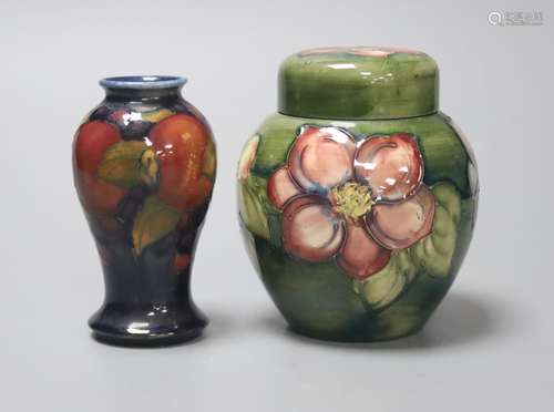 A Moorcroft Hibiscus jar and a similar Pomegranate vase, hei...