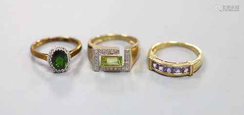 A peridot and diamond set 9ct gold ring, a 9ct gold cluster ...