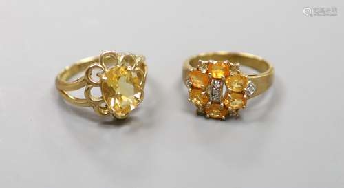 Two 9ct gold citrine set rings,gross 8.6 grams.