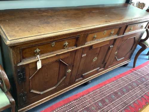 An 18th century oak low dresser, width 182cm depth 47cm heig...