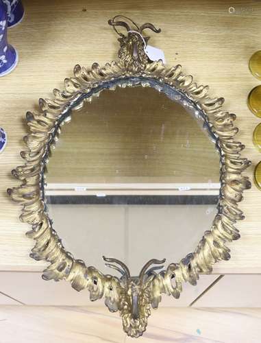 An Adam revival ormolu goat's heads wall mirror, length 60cm