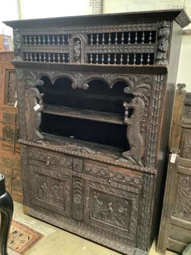 A late 19th century Flemish carved oak cabinet, width 145cm ...