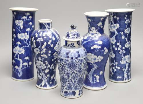 Four Chinese prunus pattern vases and a vase and cover, tall...