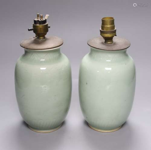 A pair of Chinese celadon vases, now as lamps, Yongzheng mar...