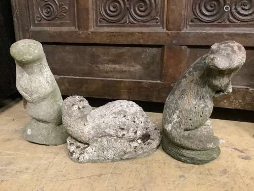 Three reconstituted stone otter garden ornaments, tallest 36...