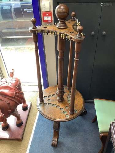 A Victorian walnut and burr walnut revolving billiard cue st...