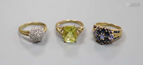 A diamond and 9ct gold cluster ring and two other 9k rings,g...