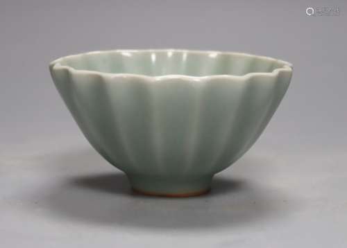 A Chinese celadon fluted cup, 9cm