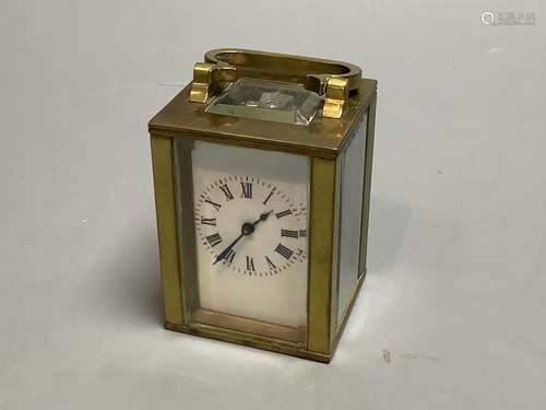 A brass cased miniature timepiece, height 6cm excluding hand...