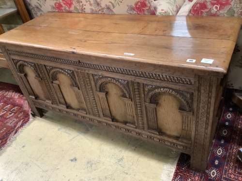 An 18th century and later oak coffer with arch panelled fron...