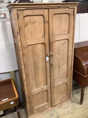 A Victorian panelled pitched pine two door cabinet, width 10...