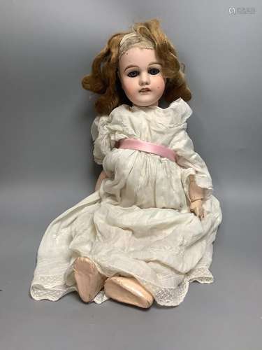 A French Mon Cheri doll, with jointed body, height 20 inches...