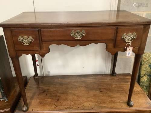 A George III mahogany lowboy fitted three short drawers, wid...