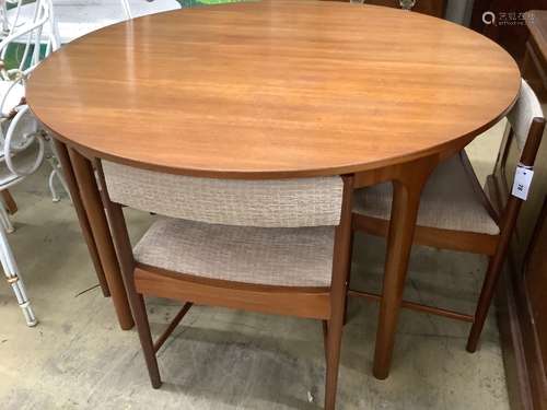 A mid century design Macintosh circular teak extending dinin...