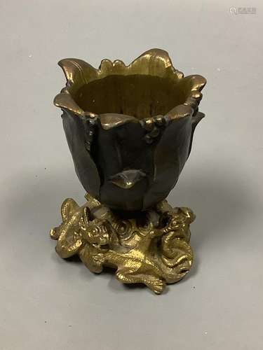 A small bronze 'tulip head' vase with gilt 'dragon' base, he...