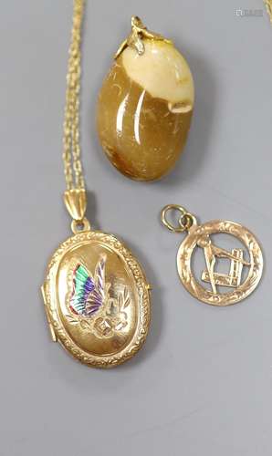 A 9ct gold Masonic watch fob, a 9ct gold locket and a hardst...