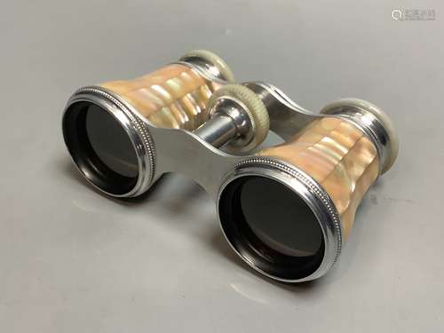 A cased pair of mother of pearl opera glasses, 6cm