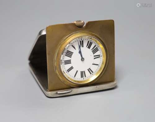 A George V silver cased travelling timepiece, with engraved ...