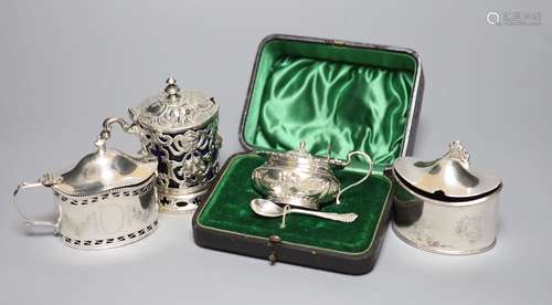 Four mustard pots, various, including a George III oval silv...