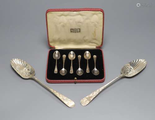 Two similar George III silver berry spoons, London, 1805 & 1...