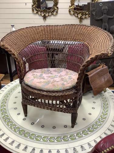 An early 20th century cane tub chair, width 80cm height 70cm