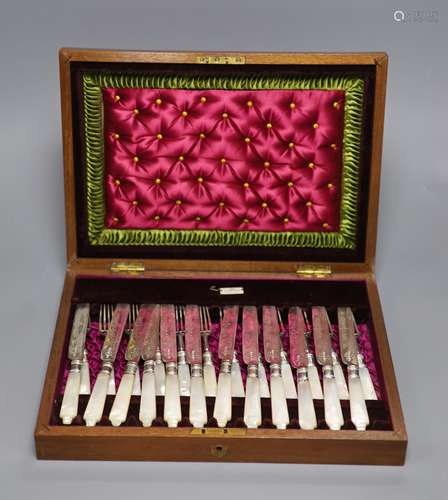 A cased set of twelve pairs of mother of pearl handled silve...