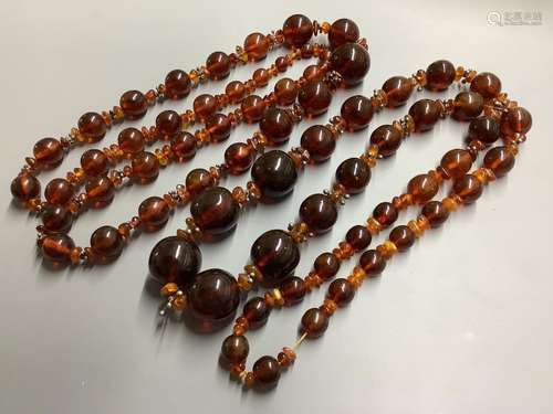 Two single strand reconstituted and natural amber necklaces,...