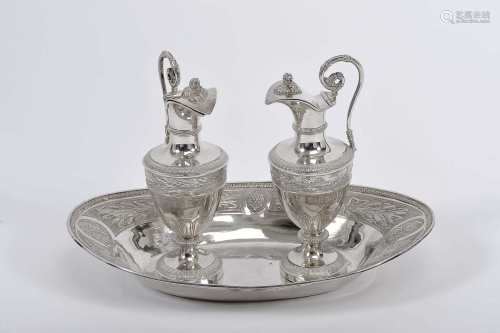 A pair of cruets with tray