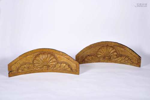 A pair of curved altarpieces