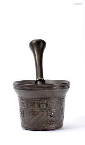 A mortar with pestle dated 1674