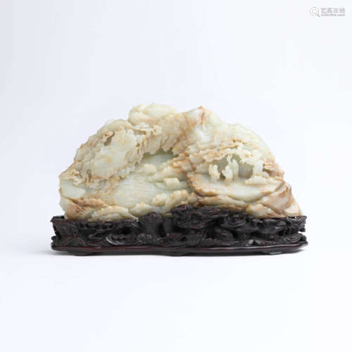 A white jade figure and landscape boulder with sandalwood st...