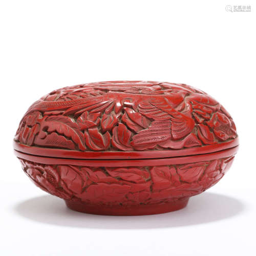 A carved cinnabar lacquer floral circular box and cover