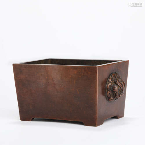 A bronze rectangular incense burner