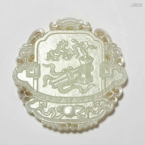 A carved white jade openwork round pendant