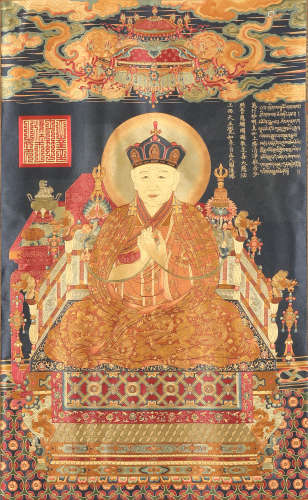 An embroidered thangka panel of seated figure