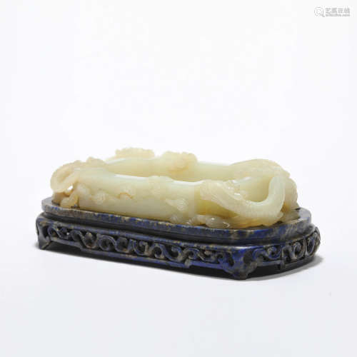 A carved white jade dragon water coupe with lapis lazuli sta...