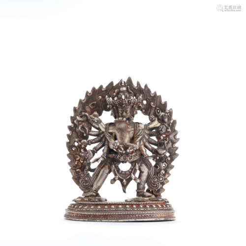 A silver statue of Kalacakravajra