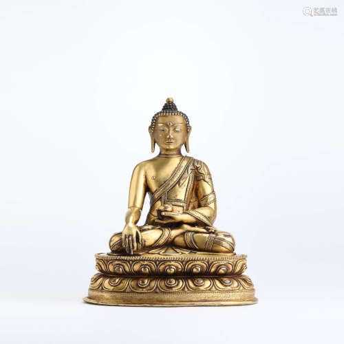 A gilt bronze seated statue of medicine buddha