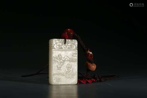 A WHITE JADE 'BOYS' INSCRIBED PENDANT