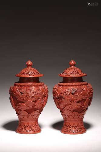 A PAIR OF CINNABAR LACQUER VASES AND COVERS