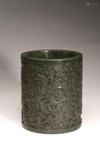 A CHINESE SPINACH GREEN JADE 'DRAGON' BRUSHPOT