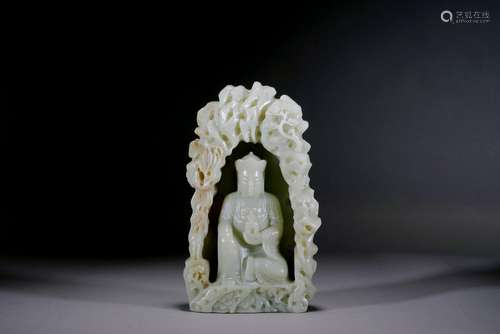 A CHINESE CELADON JADE CARVED BUDDHA IN GROTTO