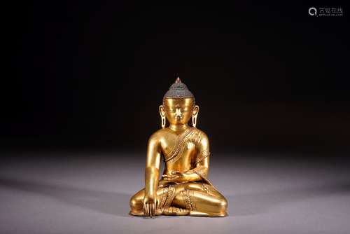 A GILT BRONZE FIGURE OF SHAKYAMUNI