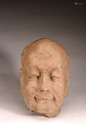 A STONE CARVED HEAD OF LUOHAN